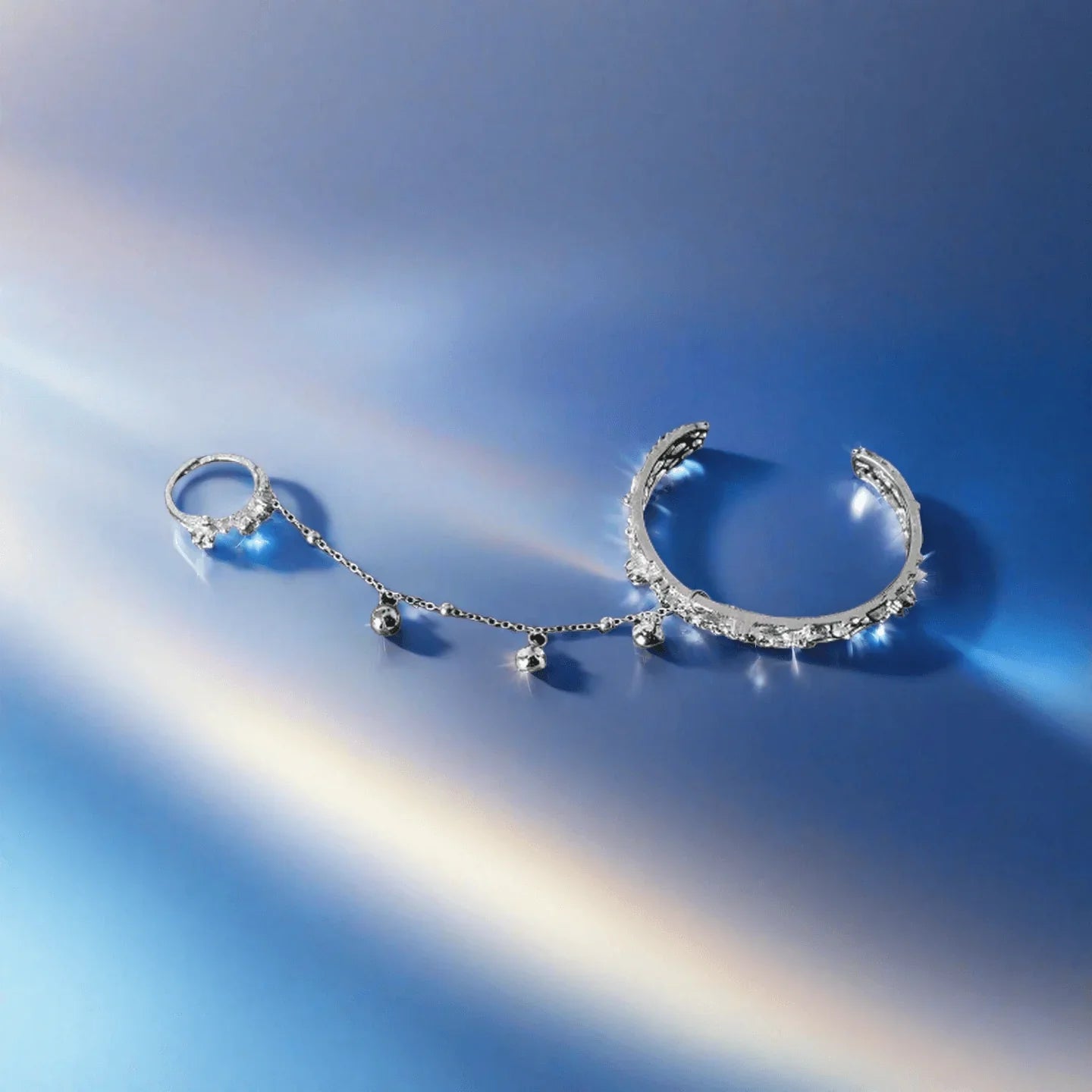 TGCF Hua Cheng & Xie Lian cosplay bracelet with bell ring bangle and adjustable finger ring on a blue gradient background. Ideal for costume accessories.