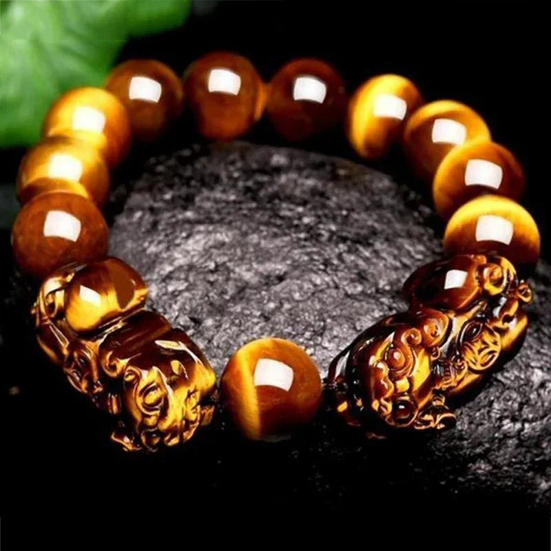 Close-up of Tiger Eye Beads Feng Shui Bracelet with detailed Pixiu charms, ideal for men and women seeking wealth and good fortune.