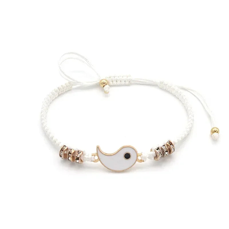 White bracelet with gold-edged Tai Chi half charm and rose gold beads, adjustable and handmade for couples' symbolic jewelry.