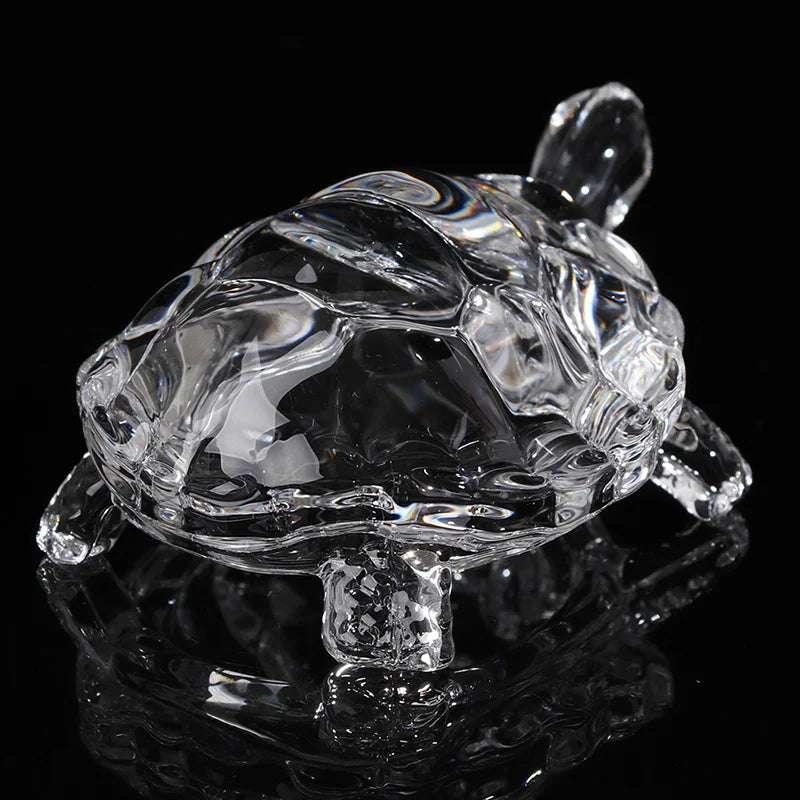 Miniature crystal turtle statue with polished finish, used as a feng shui lucky charm in home decor.
