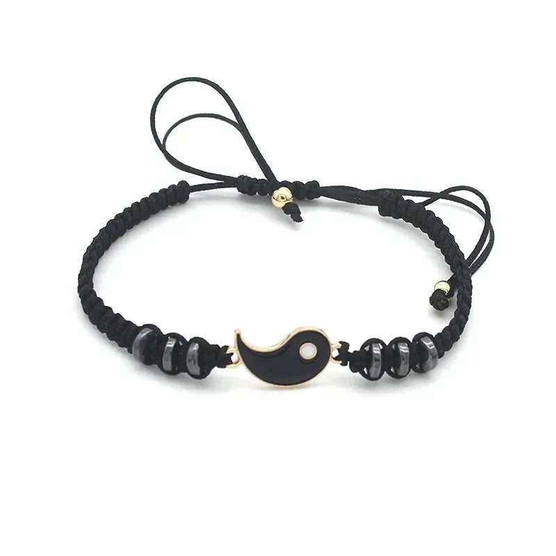 Black adjustable bracelet with gold-edged black Tai Chi half charm and glossy bead accents, part of Yin Yang couple set.