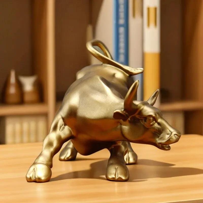 Close-up of gold Feng Shui wealth bull statue, perfect for office desktop or home decor to enhance financial energy.