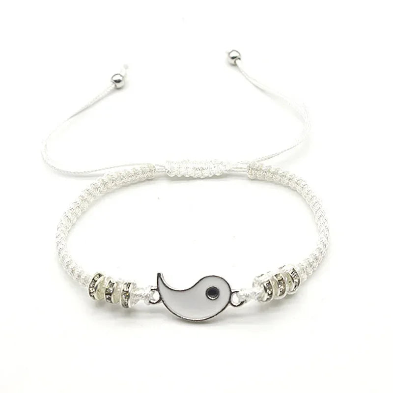 White adjustable bracelet with silver-edged Tai Chi half charm and sparkling bead accents, part of Yin Yang couple jewelry.