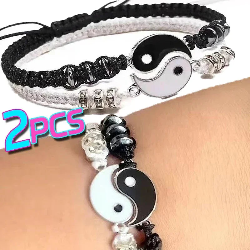 Set of 2 adjustable Yin Yang couple bracelets in black and white with Tai Chi charm, symbolizing love and balance in stylish woven design.