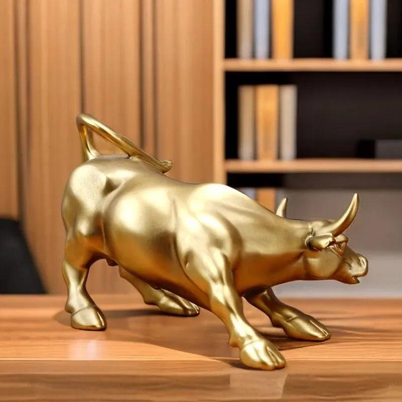Golden Feng Shui bull figurine placed on an office desk, symbolizing prosperity and strength in home and garden decor.