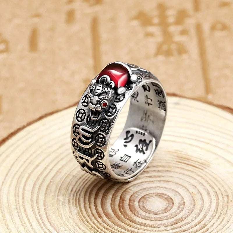 Feng Shui Pixiu Ring Silver Adjustable Wealth Amulet featuring red gem-eyed Pixiu and spiritual engravings for men and women.