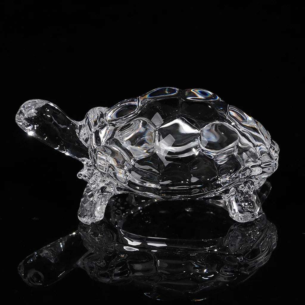 Side view of miniature crystal tortoise statue, feng shui figurine for enhancing home and garden ambiance.