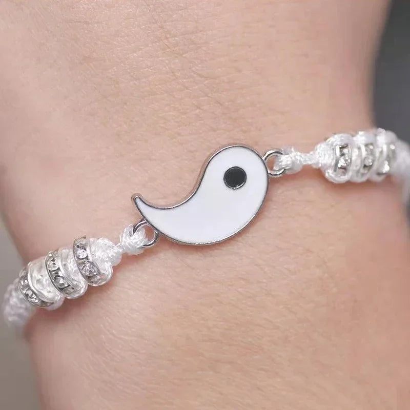 White half of Yin Yang bracelet with silver-tone bead accents and adjustable woven cord, part of handmade couple jewelry set.