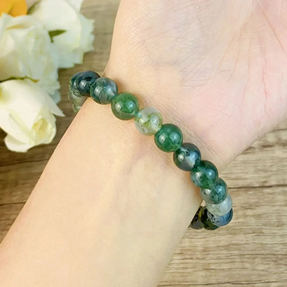 Close-up of 8MM Moss Agate Bracelet on wrist, emphasizing real natural crystal beads for healing, fengshui, and meditation.