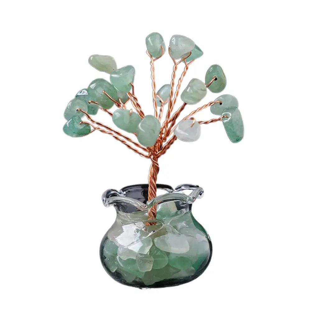 Green aventurine Handmade Feng Shui Crystal Tree Decor for Healing Energy with polished stones and copper wire in a transparent glass container.