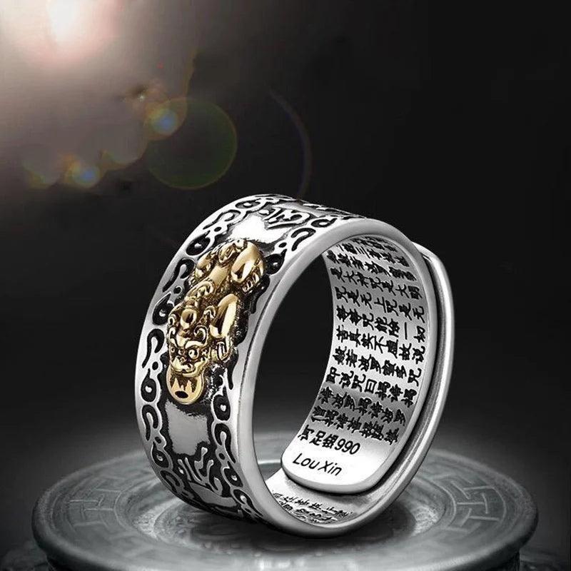 Feng Shui Pixiu Ring Silver Adjustable Wealth Amulet with gold Pixiu figure and engraved script for men and women.