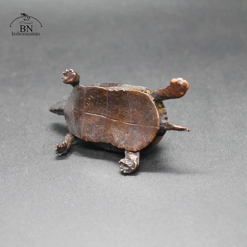 Underside view of the Vintage Copper Bagua Feng Shui Turtle Statue, highlighting craftsmanship and antique finish for home and garden decor.