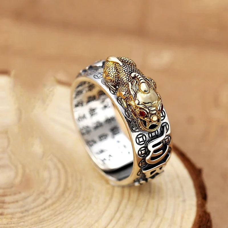 Feng Shui Pixiu Ring Silver Adjustable Wealth Amulet with golden Pixiu and engraved Chinese characters for men and women.