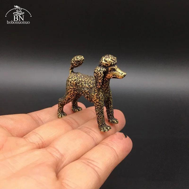 Pure Copper Feng Shui Dog Statue Lucky Poodle Figurine shown on hand for scale, ideal for home desk decoration and good luck charm.
