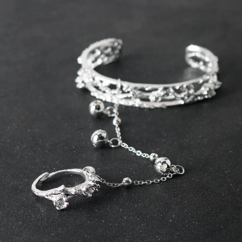 Detailed TGCF Hua Cheng & Xie Lian cosplay bracelet with ornate silver bangle and ring connected by chain and bells, ideal for costume accessories.