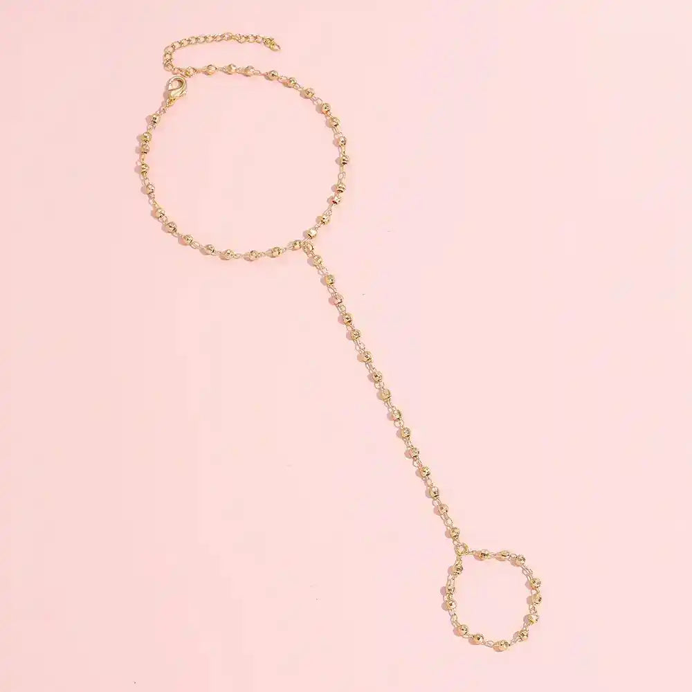 Gold-Plated Faceted Bead Hand Chain Bracelet with Linked Finger Ring – Eye-Catching Fashion GoddessJewelry for Modern