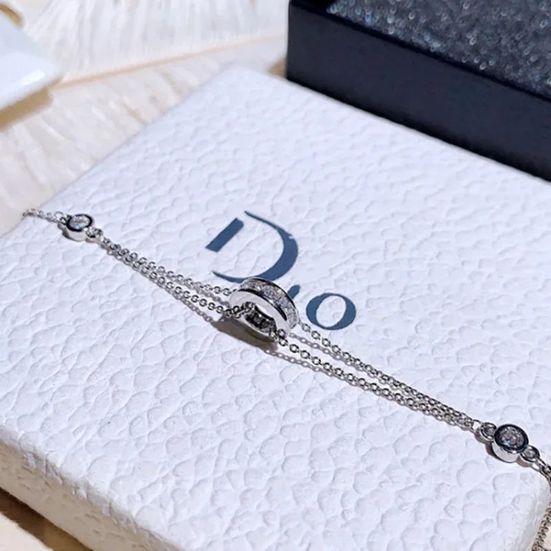 Silver-toned Super Sparkling Diamond Bracelet with sparkling central ring and side stones, perfect for elegant fashion styling.