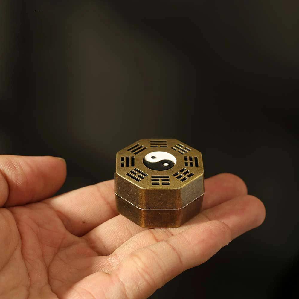 Octagonal Feng Shui incense holder featuring a yin-yang symbol and trigrams, suitable for spiritual decor and meditation spaces.