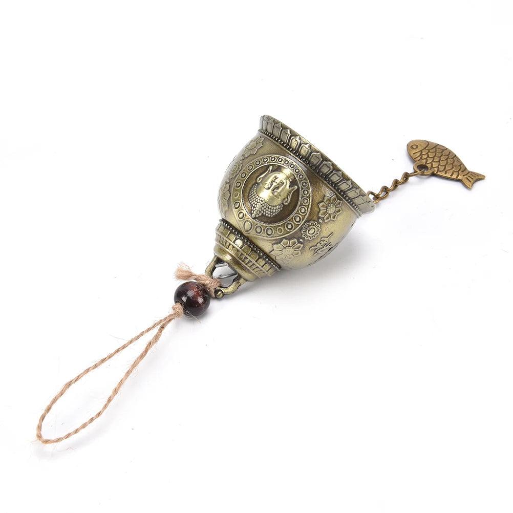 Angled view of the Lucky Feng Shui Wind Chime Buddha Bell showing detailed carvings and fish charm, perfect for spiritual home decoration.