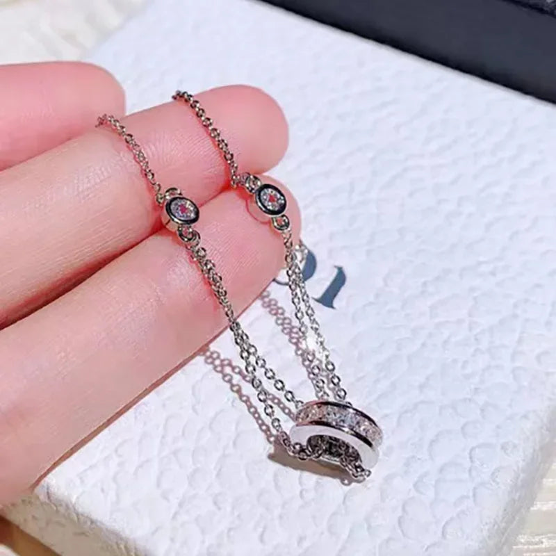Hand holding silver Super Sparkling Diamond Bracelet showcasing intricate diamond details and fine chain craftsmanship.