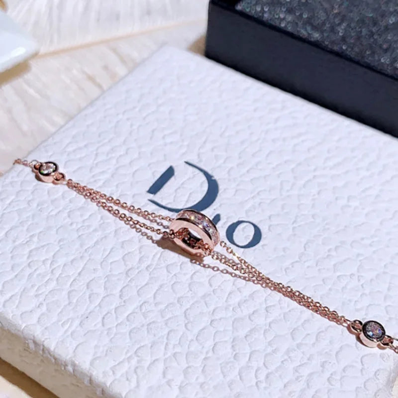 Close-up of rose gold Super Sparkling Diamond Bracelet featuring a central diamond-studded ring and delicate chain design.