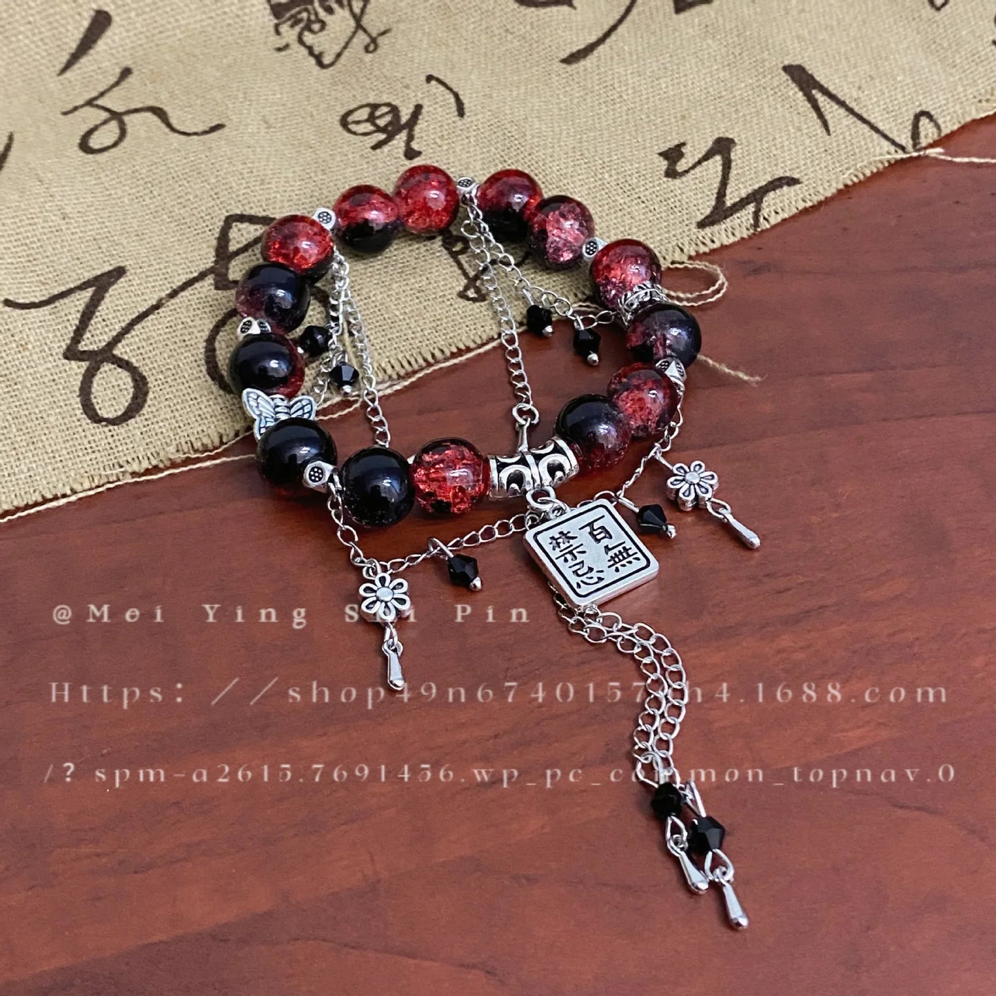 Close-up of TGCF Cosplay Bracelet Set with red-black beads, silver chains, and character charms, perfect for Heaven Official’s Blessing enthusiasts.